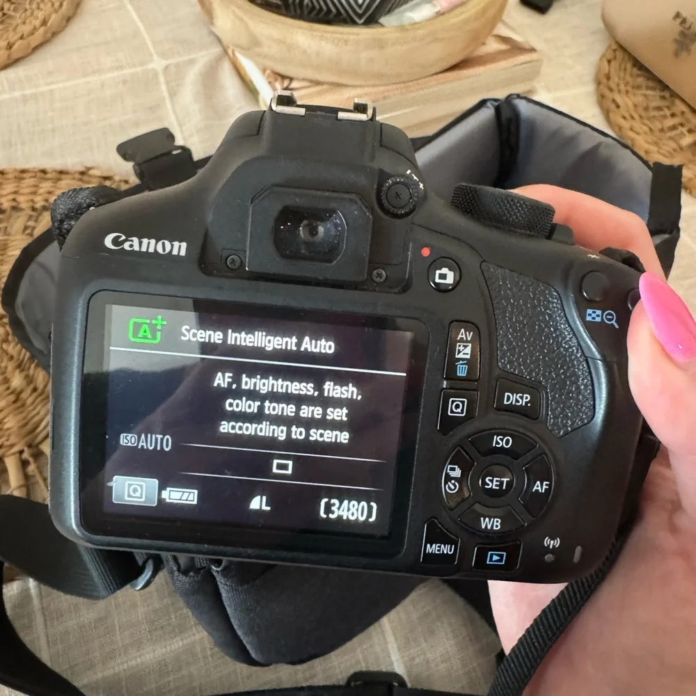 Canon Black Digital Camera with Zoom Lens (Not shown)
